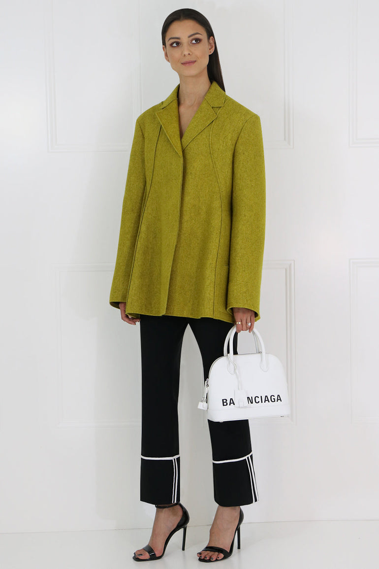 JIL SANDER RTW SCULPTURAL FLARED JACKET OCHRE